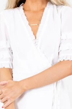 The One White Wrap Mini Dress 11 The One White Wrap Mini Dress -Outlet Bella Ella Boutique Store TheOneWhiteDressDetail 5000x