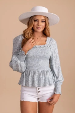 Desert Wildflower Smocked Long Sleeve Top 23 Desert Wildflower Smocked Long Sleeve Top -Outlet Bella Ella Boutique Store desertwildflowersmockedtoplightbluefront 5000x